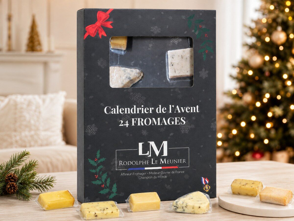 Le calendrier de l’Avent fromage Rodolphe Le Meunier posé sur une table de fête avec des fromages