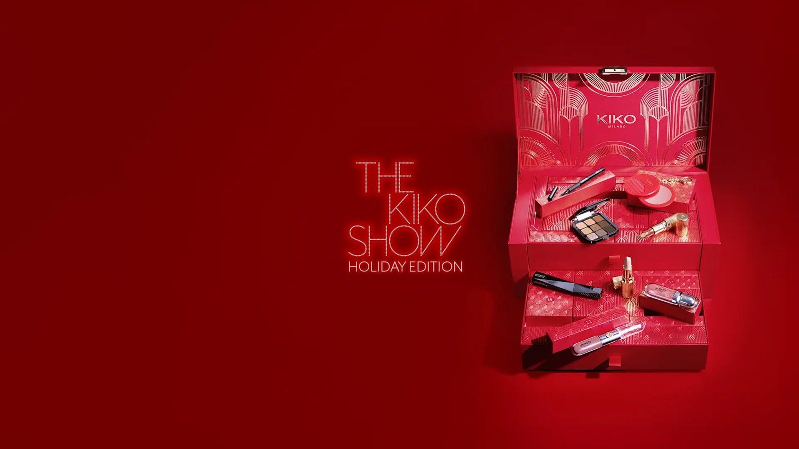 Le calendrier de l’Avent Kiko Milano 2026, un coffret rouge et or ouvert avec ses deux tiroirs remplis de maquillage