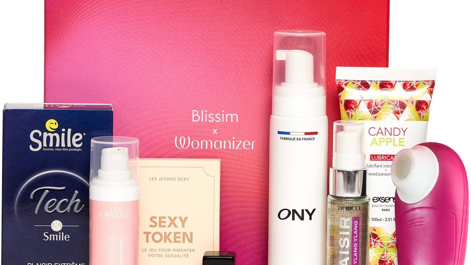 Le coffret Blissim Plaisir avec Womanizer ouvert, avec le Womanizer Mini 2 rose et les produits du coffret